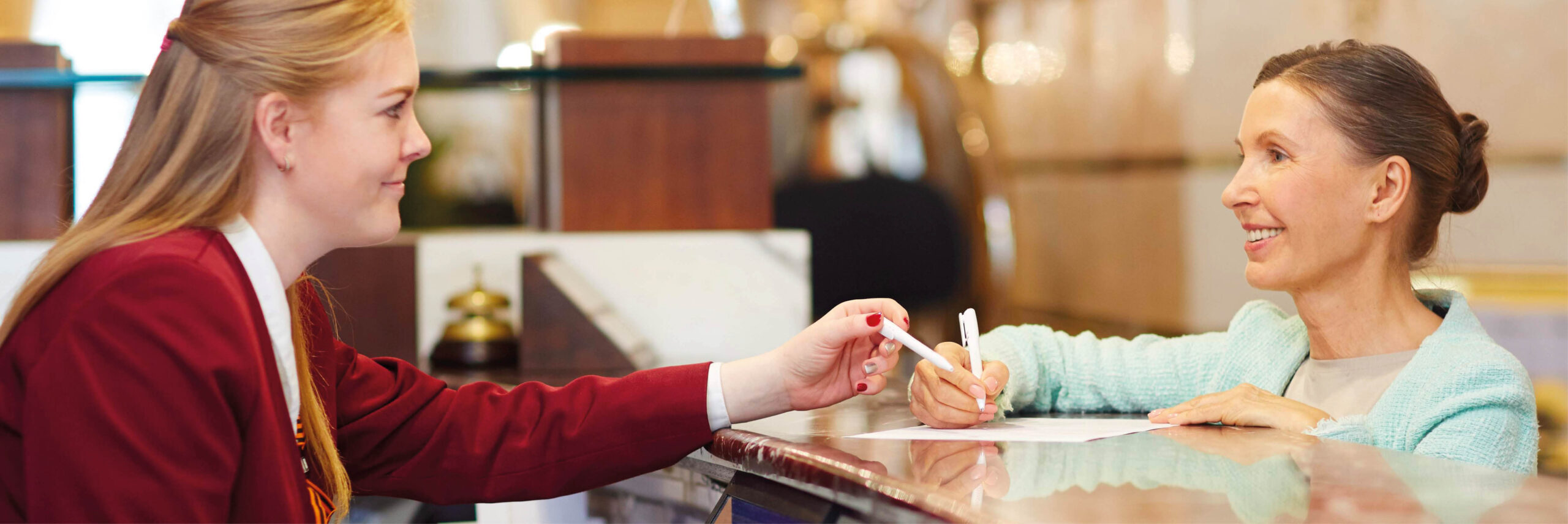 This is an image of a guest checking in at a hotel.