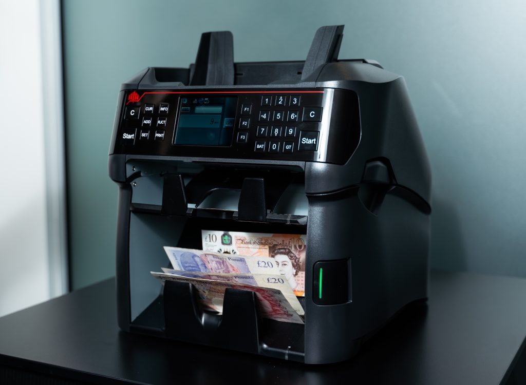 Desktop machine counting GBP pound