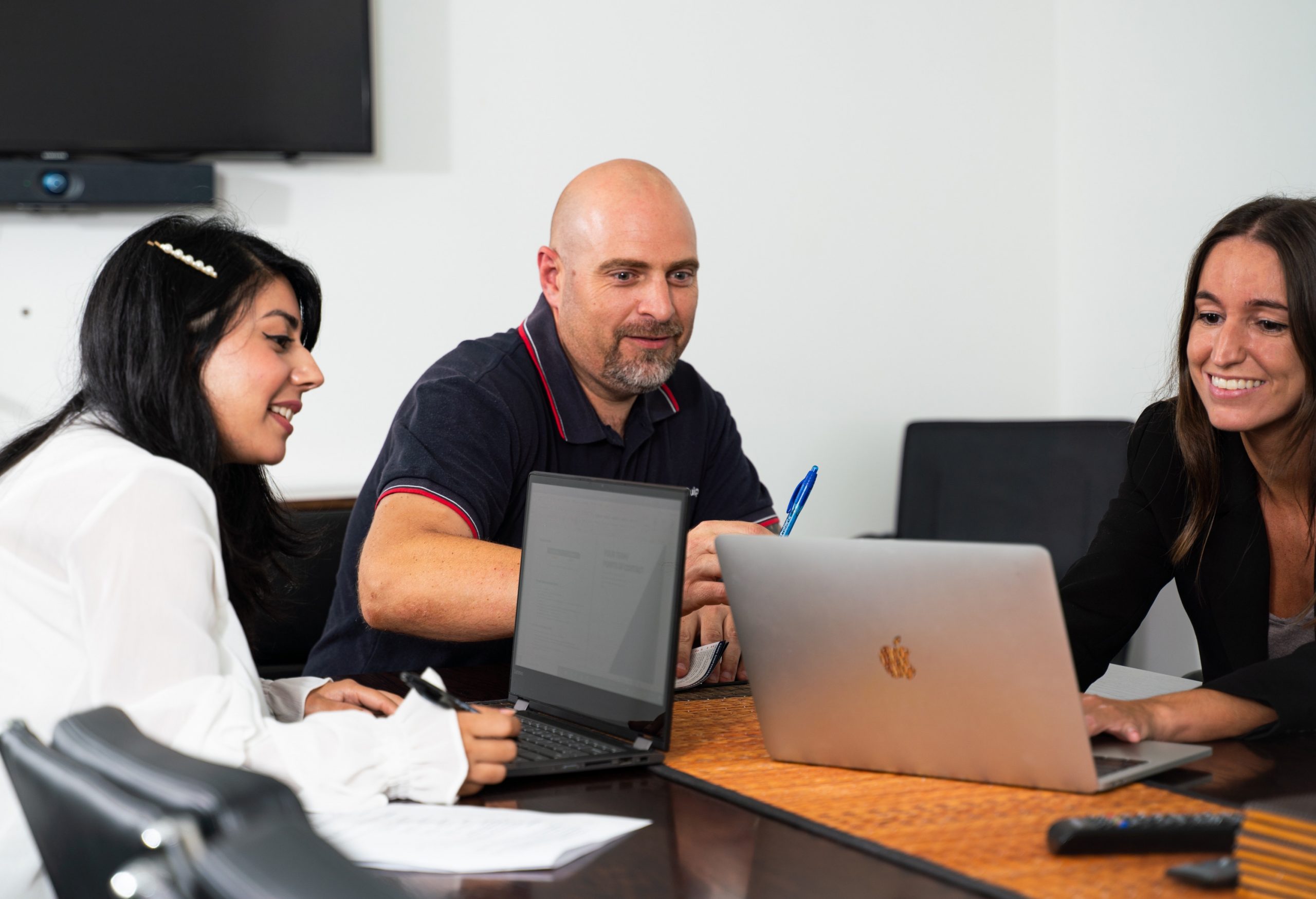 A photo of Consillion's Account Service Managers constantly monitoring solution performance
